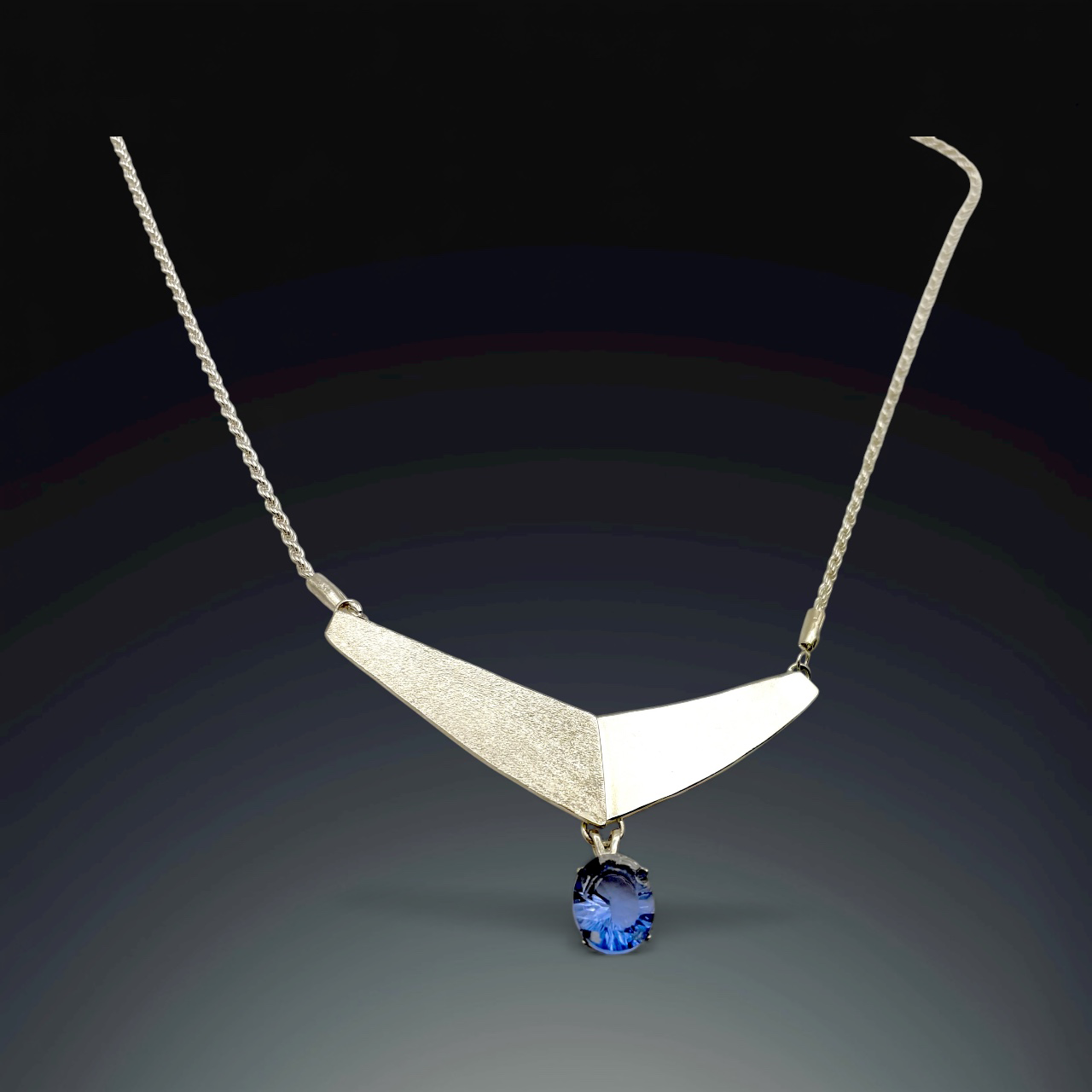 63 Twin Planes with Tanzanite Drop