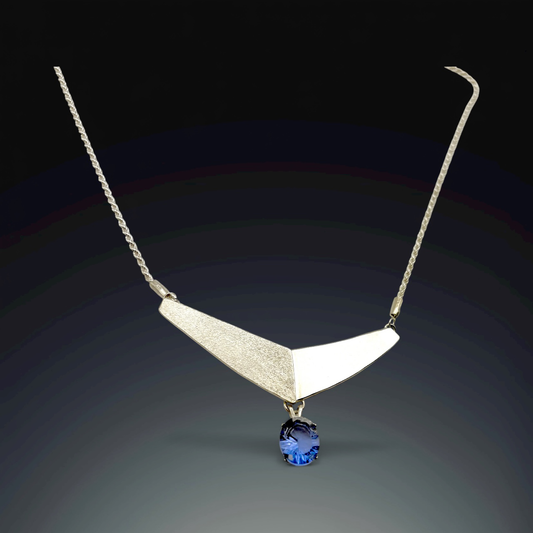 63 Twin Planes with Tanzanite Drop