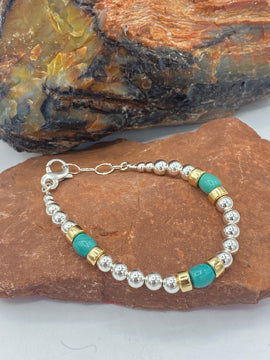 Sterling silver beaded bracelet with gold accent beads 4085