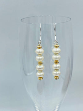 White Button Pearls hang delicately from sterling silver ear wires 4082 - 0 x 0 x 0