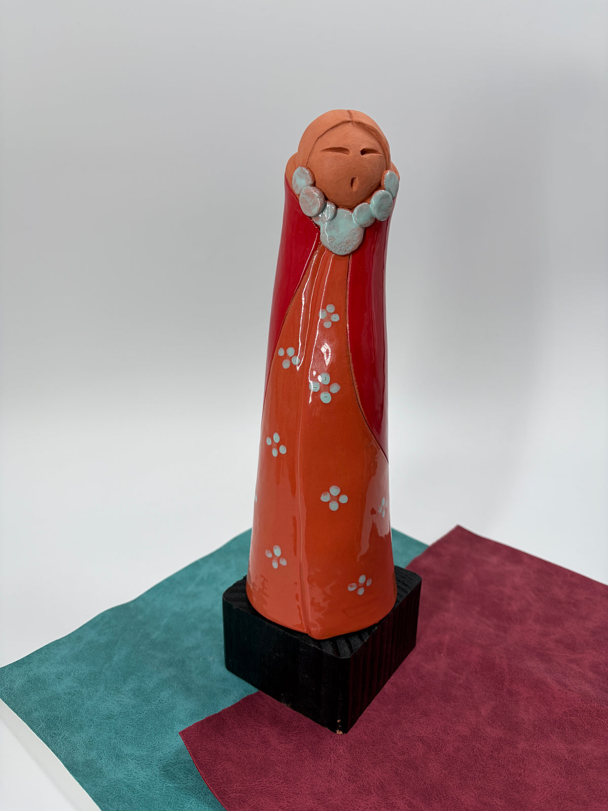 Standing Figure in Orange and Red