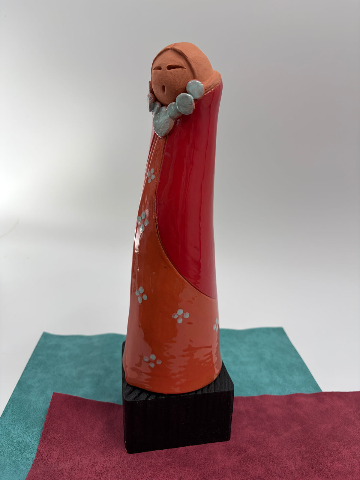 Standing Figure in Orange and Red