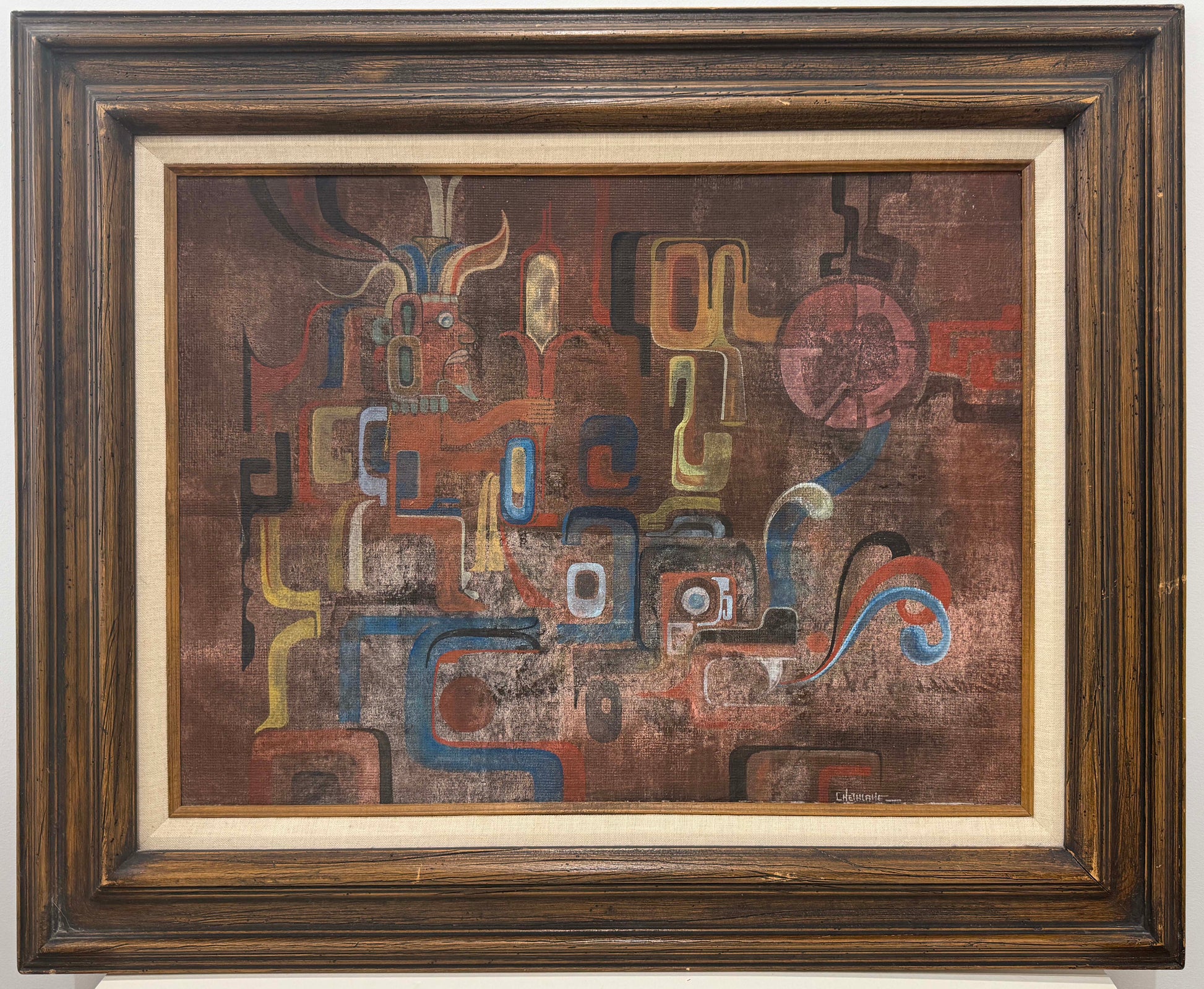 Wall Painting on Ancient Mexican Bath features an abstract composition with brown, red, yellow, and blue geometric and curved shapes, highlighted by a prominent circular form on the right side. This striking piece of framed art is presented with a dark wood frame and beige mat, enhancing its sophisticated appeal. The framed dimensions are 27x32 inches.