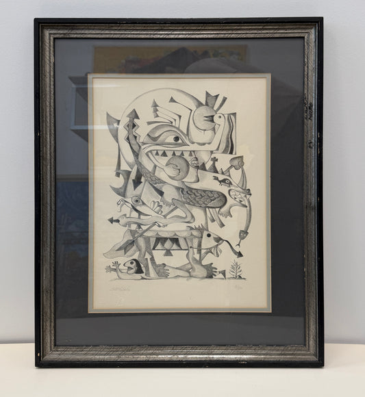 Framed "Pueblo Spirits 8/50" abstract black-and-white drawing featuring geometric and organic shapes, faces, and animal-like forms, displayed as sophisticated wall decor in a 17x20 frame against a plain wall.
