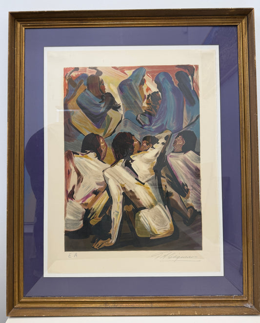 Framed abstract painting titled "Los Indios 18/25 EA" features several figures with dark hair and white clothing, sitting and interacting against a colorful, dynamic background. The brown picture frame with a purple mat enhances the artwork’s vibrant appeal, while the overall framed dimensions measure 28x34 inches.