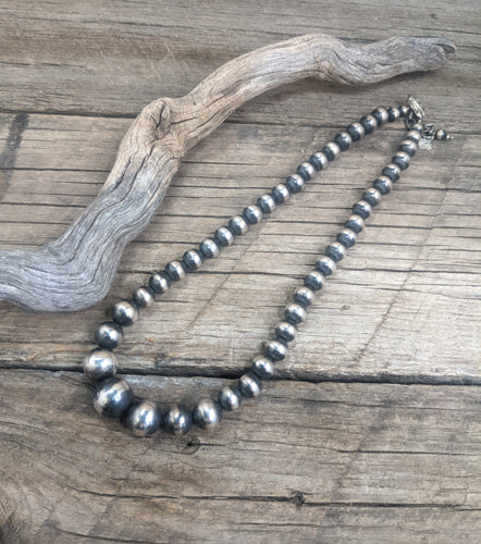 Neck: graduated Navajo pearls 1313