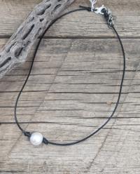 Necklace: white FWP w/ coils on 1,5mm black leather by Myra Gadson